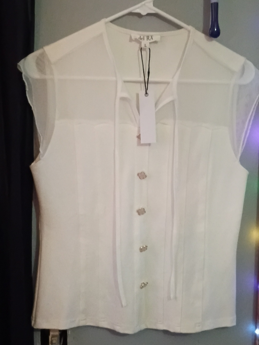 Sleeveless Tie-Neck White Blouse with Decorative Buttons